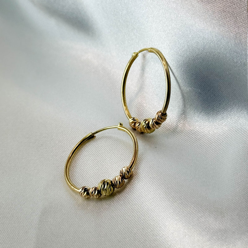 گوشواره حلقه‌ای طلا ۱۸ عیار ۱.۷۶۰ گرم – جواهری زمرد